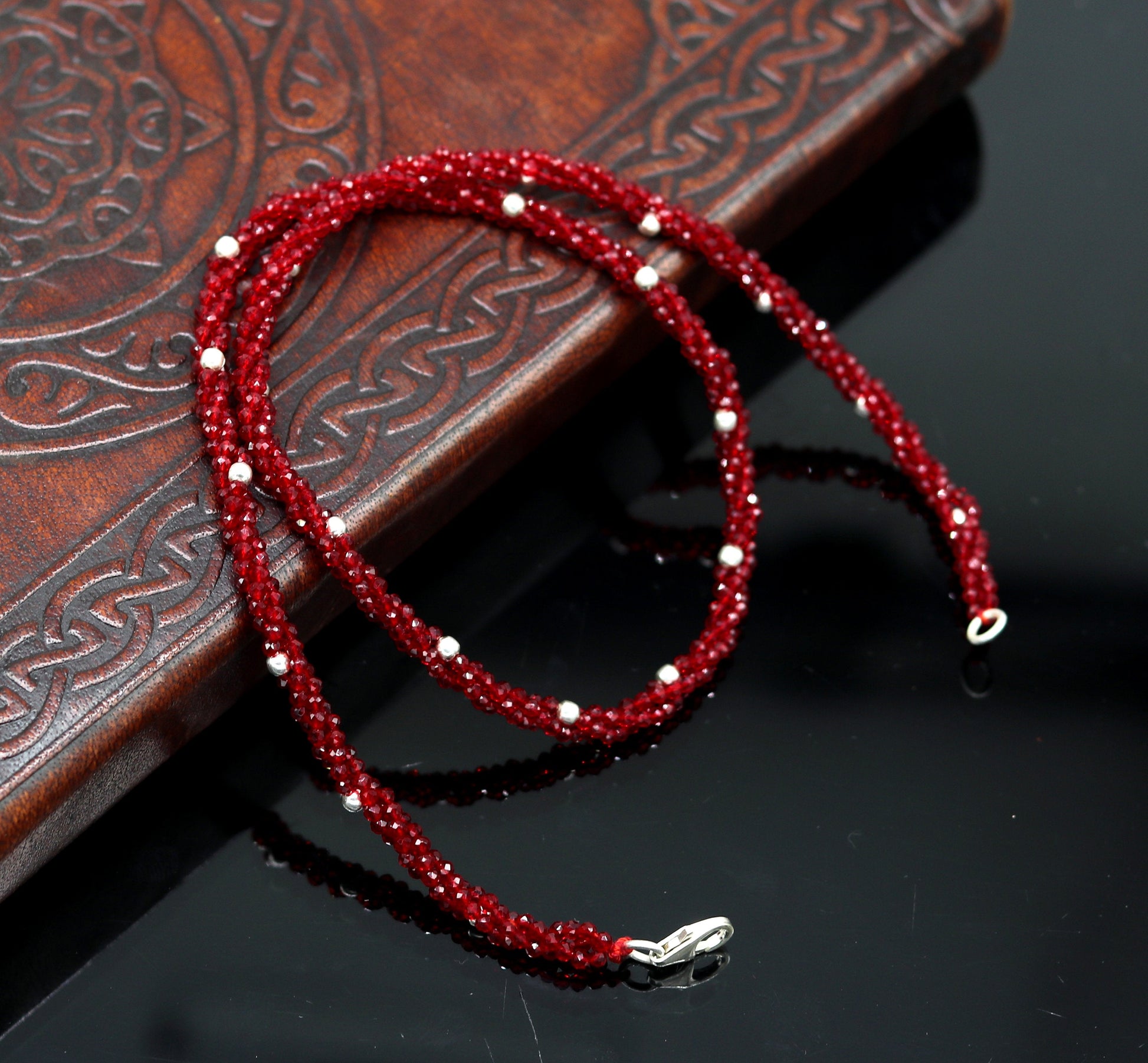 18-inch tribal beaded necklace set with triple strands, semiprecious cut stones, and silver beads, featuring a galaxy-inspired design.