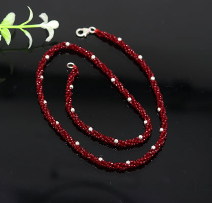 18-inch tribal beaded necklace set with triple strands of semiprecious cut stones and silver beads, galaxy-inspired design.