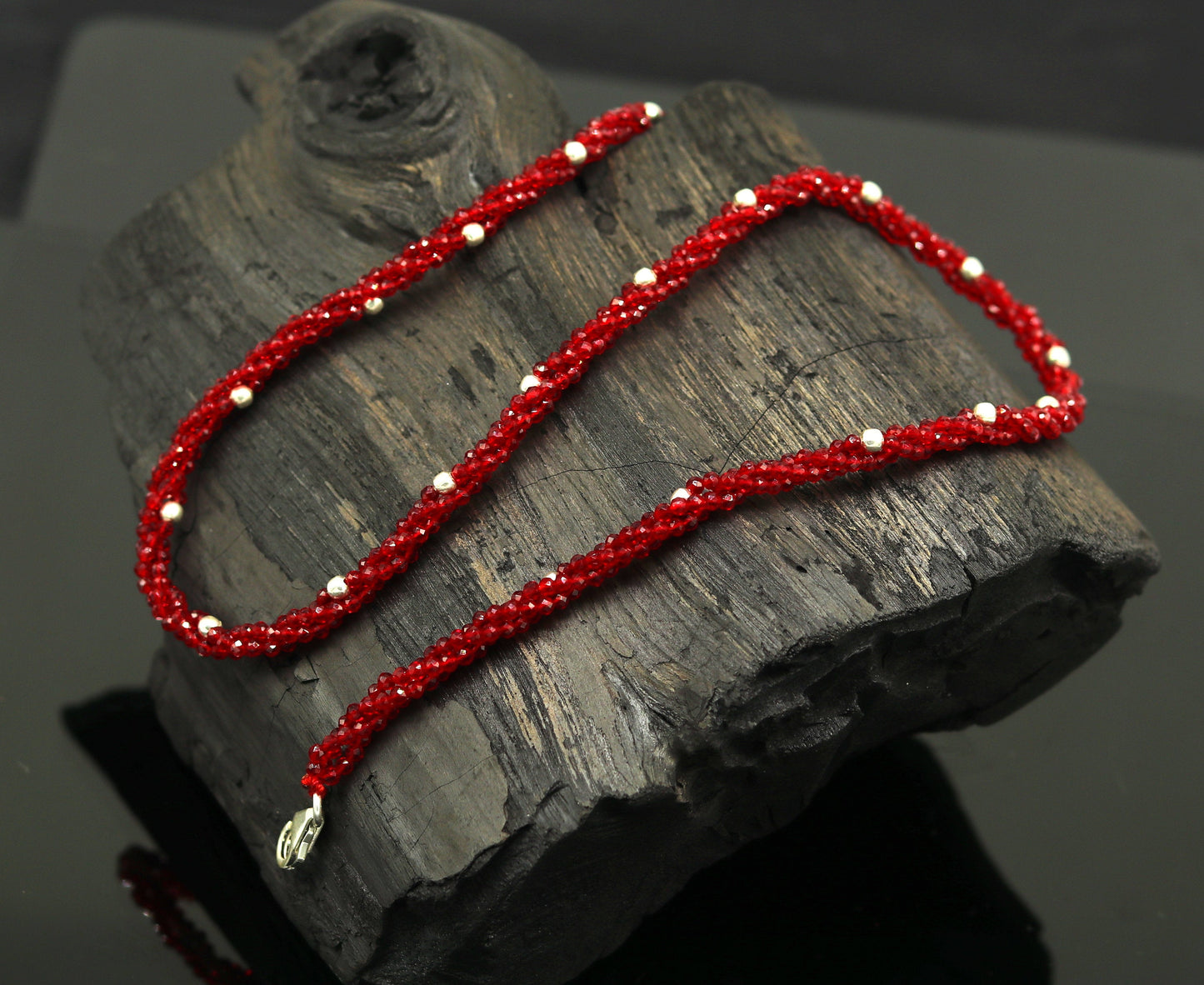 18-inch TRIBAL ORNAMENTS beaded necklace with triple strands, semi-precious stones, silver beads, galaxy-inspired design.