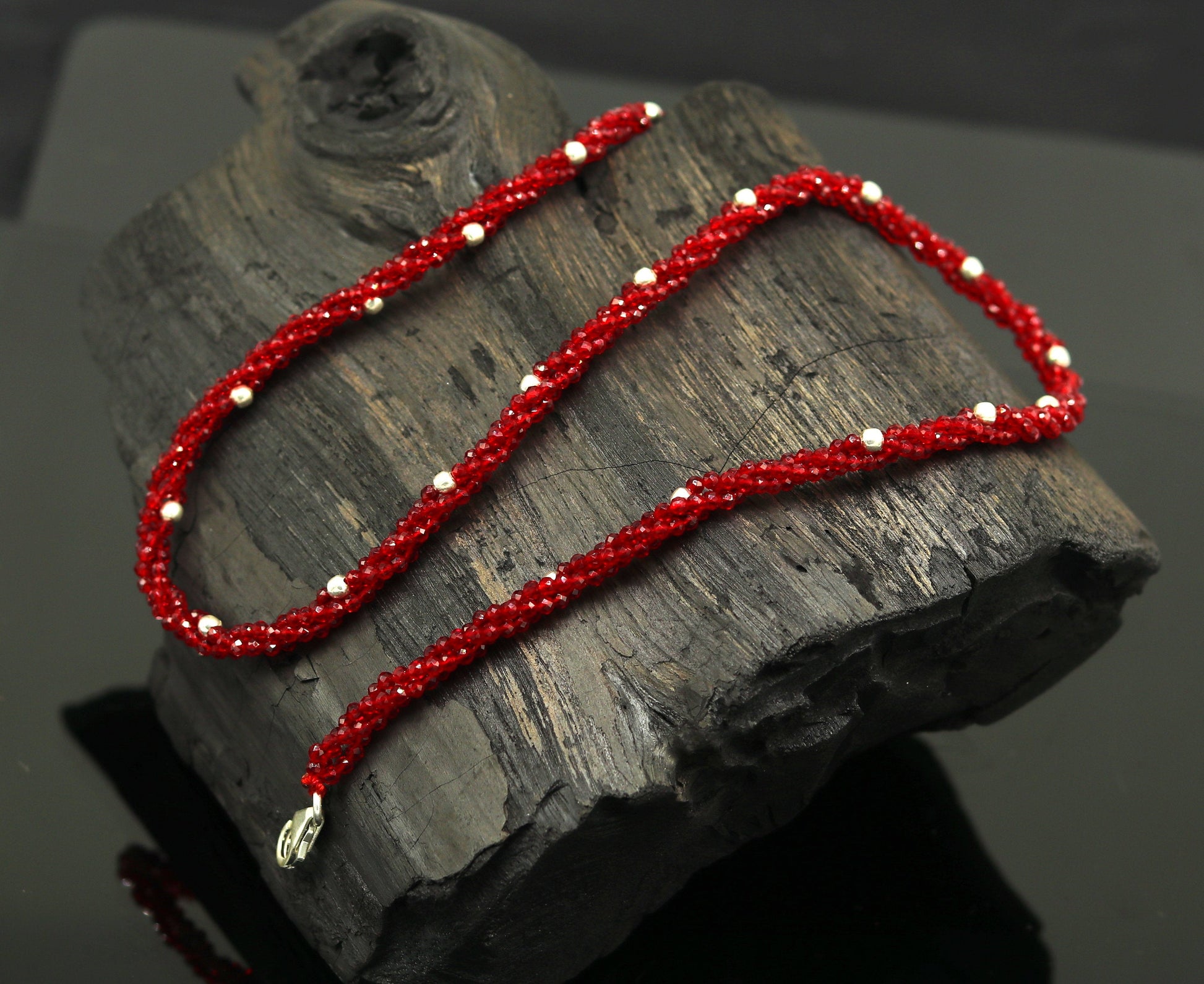 18-inch TRIBAL ORNAMENTS beaded necklace with triple strands, semi-precious stones, silver beads, galaxy-inspired design.