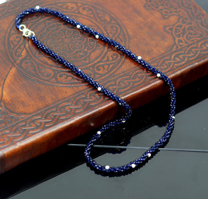 18-inch beaded necklace by TRIBAL ORNAMENTS with triple strands, semiprecious stones, and silver beads in galaxy-inspired design.