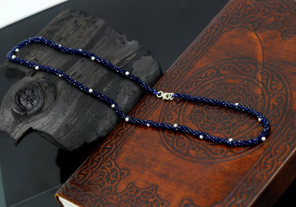 18-inch tribal beaded necklace by TRIBAL ORNAMENTS with triple strands, semiprecious stones, and silver beads in galaxy-inspired design