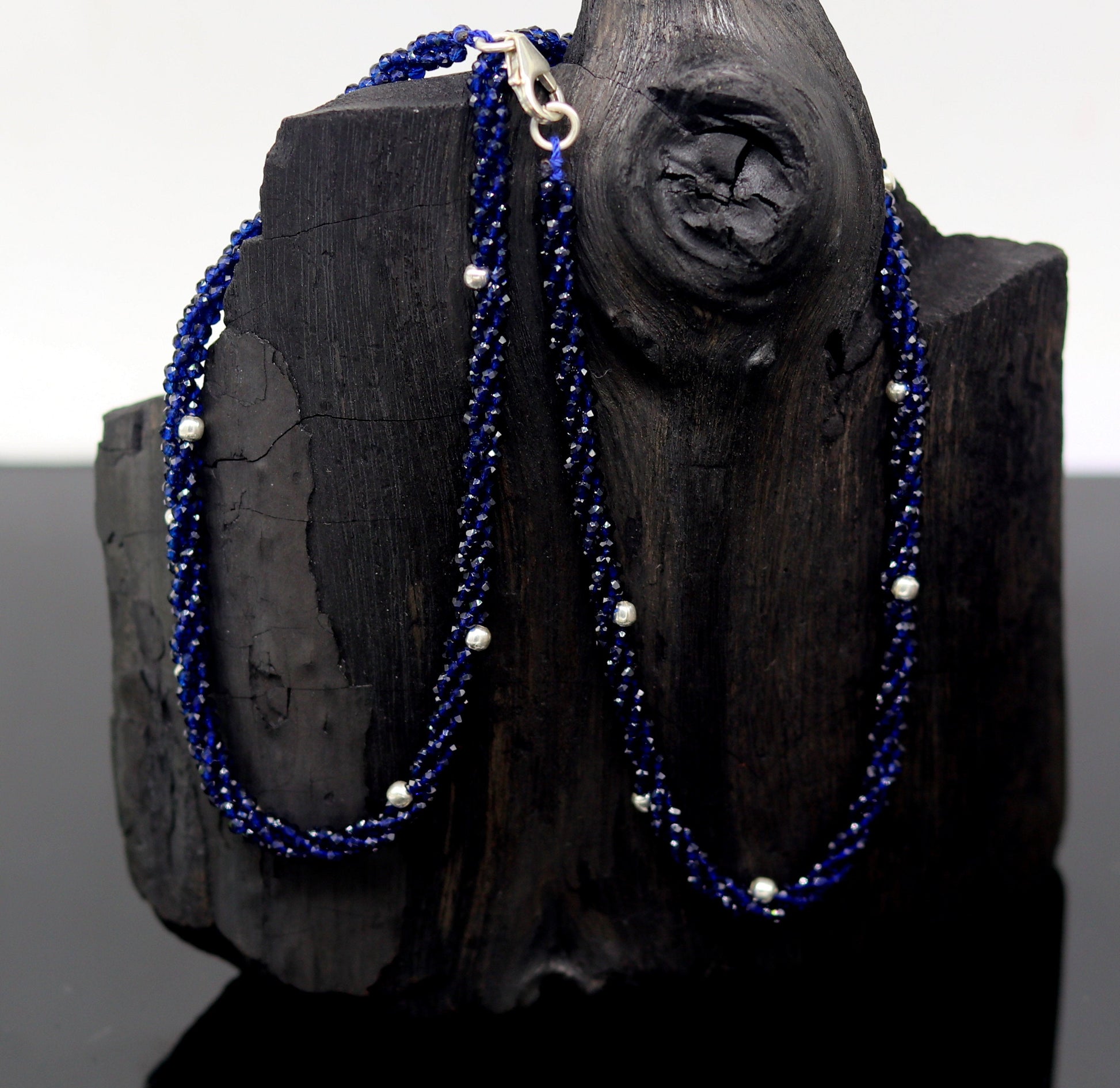 18-inch tribal beaded necklace with triple strands, semiprecious cut stones, and silver beads, featuring a galaxy-inspired design.