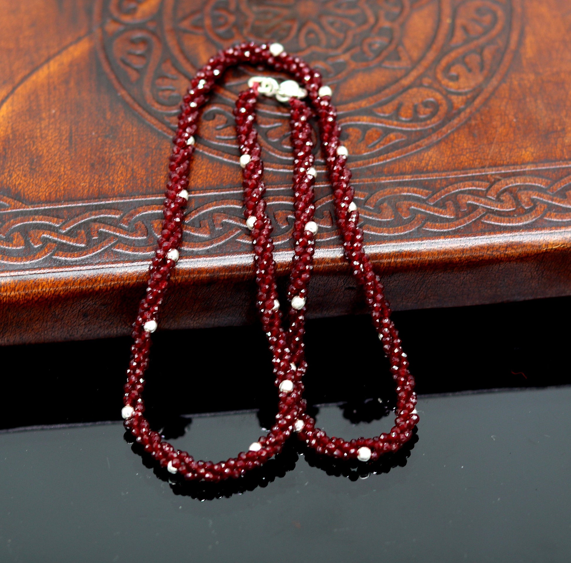18-inch tribal beaded necklace with triple strands, semiprecious cut stones, and silver beads, featuring a galaxy-inspired design.