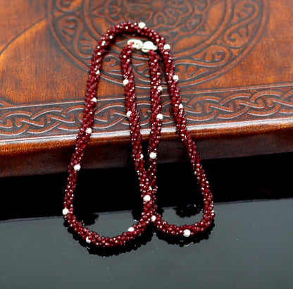 18-inch tribal beaded necklace with triple strands, semiprecious cut stones, and silver beads, featuring a galaxy-inspired design.