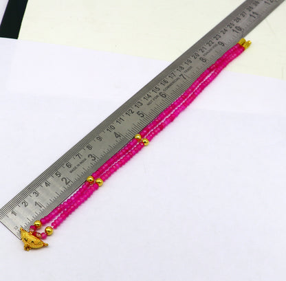 18-inch faceted pink beaded necklace with 20kt yellow gold amulet pendant, tribal ethnic jewelry for brides or special occasions.