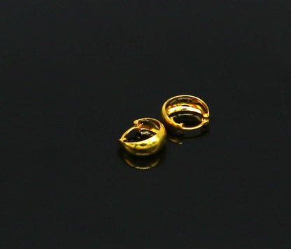 18kt yellow fine gold handmade customized huggie hoop earrings by TRIBAL ORNAMENTS, perfect for brides, clip-on design.