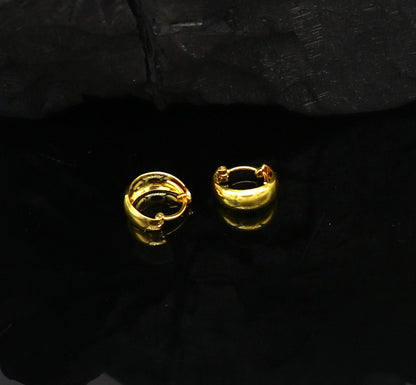 18kt yellow gold handmade customized huggie hoop earrings by TRIBAL ORNAMENTS, perfect for brides, clip-on jewelry, elegant design