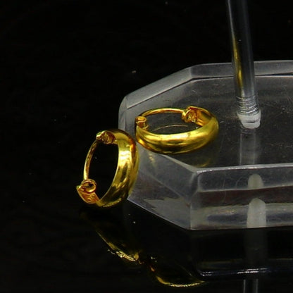 18kt yellow gold handmade customized huggie hoop earrings by TRIBAL ORNAMENTS, perfect for brides, clip-on design, fine jewelry.