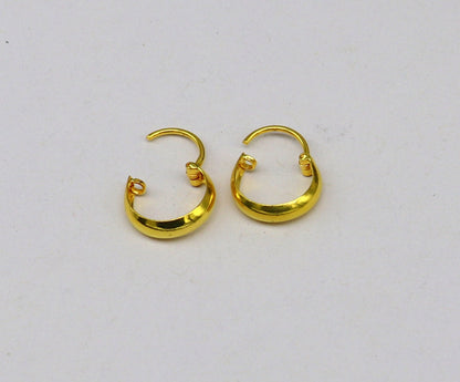 18kt yellow gold handmade customized huggie hoop earrings by TRIBAL ORNAMENTS, perfect for brides, clip-on style jewelry.
