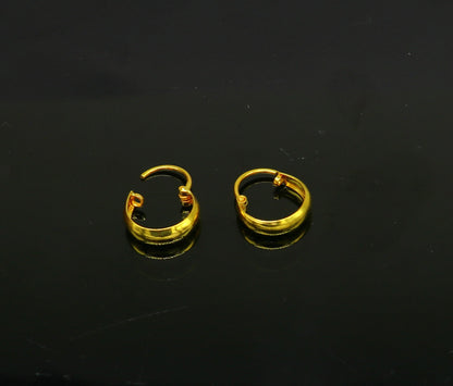 18kt yellow gold handmade customized huggie hoop earrings by TRIBAL ORNAMENTS, perfect for brides, clip-on design, fine jewelry.