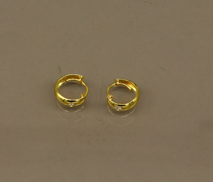 18kt yellow gold single stone huggie hoop earrings by Tribal Ornaments, clip-on style perfect for brides and jewelry gifting.