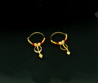 18kt yellow gold handmade vintage-style hoops earrings by TRIBAL ORNAMENTS, stylish designer jewelry for women and girls from India.