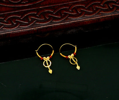 18kt yellow gold handmade vintage-style hoops earrings by TRIBAL ORNAMENTS, stylish designer jewelry for women and girls from India.