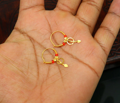 18kt yellow gold handmade vintage hoops earrings by TRIBAL ORNAMENTS, stylish designer jewelry for women and girls from India.