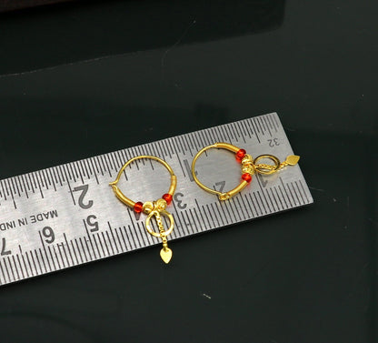 18kt yellow gold handmade vintage hoops earrings by Tribal Ornaments, stylish Bali-inspired jewelry for women and girls.