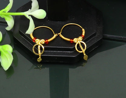 18kt yellow gold handmade vintage-style hoops earrings from TRIBAL ORNAMENTS, stylish designer jewelry for women and girls from India.