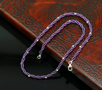 19-inch tribal beaded necklace by Tribal Ornaments with purple semi-precious beads and silver accents in a triple-strand galaxy design.