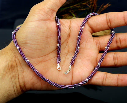 19-inch TRIBAL ORNAMENTS beaded necklace with triple strands of purple semiprecious beads and silver accents, galaxy-inspired design