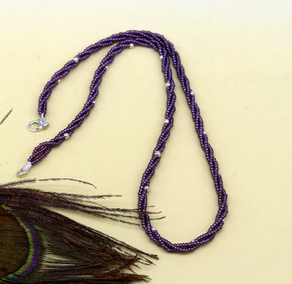 19-inch Tribal Ornaments beaded necklace with triple strands of purple semiprecious beads and randomly placed 925 silver beads.