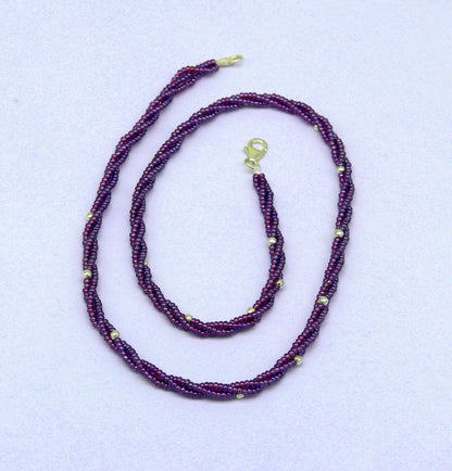 19-inch TRIBAL ORNAMENTS beaded necklace with triple strands of purple semiprecious beads and silver accents, galaxy-inspired design.