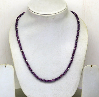 Tribal Ornaments 19" customized beaded necklace with triple strands of purple semiprecious beads and silver accents.