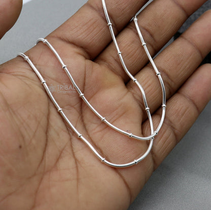 Sterling silver 1mm 18-inch handmade snake chain necklace with a sleek, trendy design from TRIBAL ORNAMENTS.