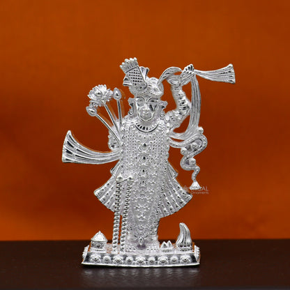 Handmade 2.5-inch sterling silver Lord Krishna Shrinathji idol figurine for puja and decorative gifts, crafted by Tribal Ornaments.