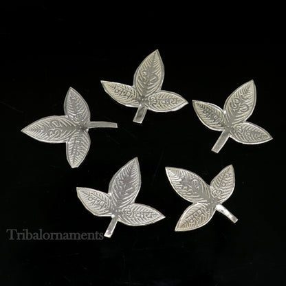 Solid silver 2.5 cm bel patra leaf for Lord Shiva worship, handmade by TRIBAL ORNAMENTS, used in puja rituals.