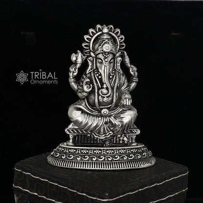 Sterling silver Lord Ganesha idol, 2.5-inch sculpture for puja, featuring intricate design and traditional Ganesha figure.