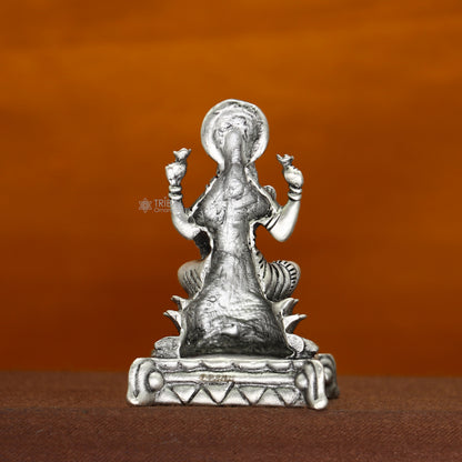 Tribal Ornaments 2-inch Goddess Lakshmi divine statue figurine for puja, symbolizing wealth and prosperity for Diwali celebrations.