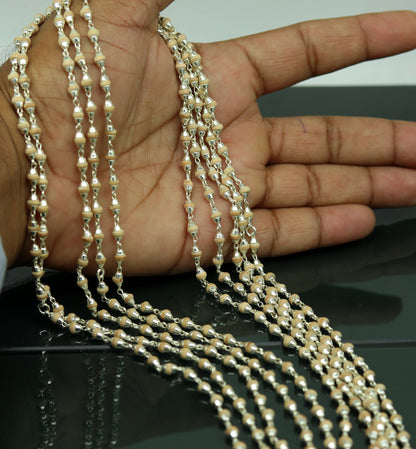 Unisex 22-inch sterling silver basil rosary beads with wooden beads on a silver chain necklace, handcrafted tulsi mala jewelry.