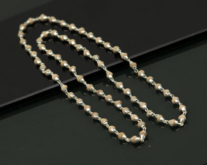 Unisex 22-inch sterling silver necklace with handmade wooden basil rosary beads and silver chain, tribal-inspired jewelry.