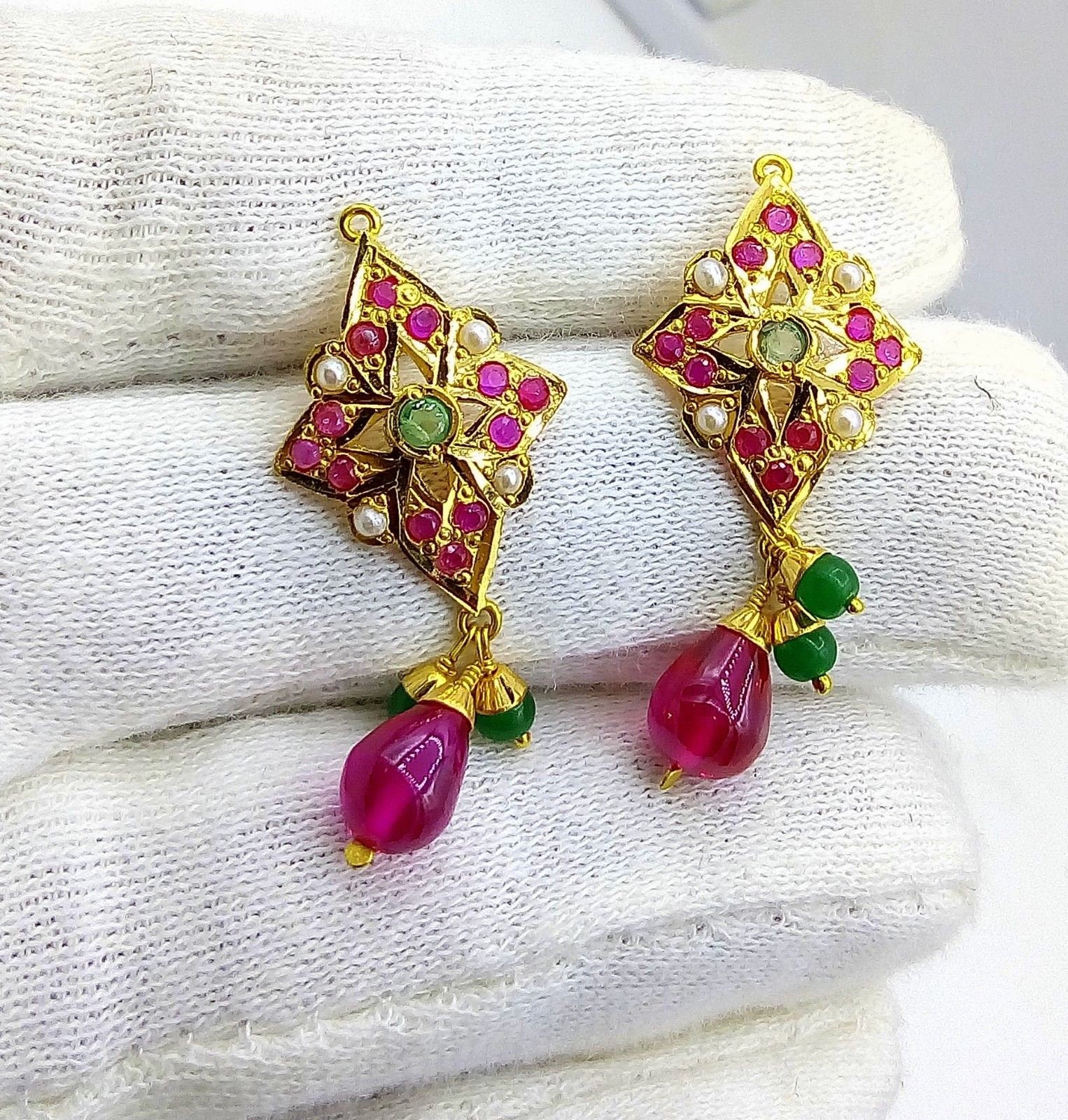 22K gold traditional Punjabi earrings with pearls, rubies, and emeralds, handcrafted Rajasthani bridal jewelry featuring red and green drops.