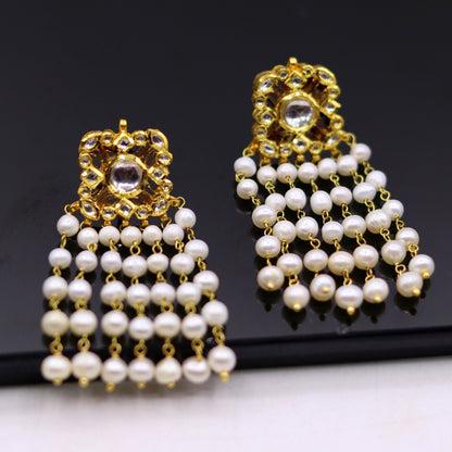 22K yellow gold handmade Kundan Jadau stud earrings with dangling pearls, intricate bridal jewelry by TRIBAL ORNAMENTS.
