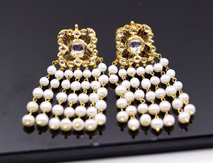 22K yellow gold handmade Kundan Jadau stud earrings with dangling pearls, exquisite bridal jewelry by Tribal Ornaments.
