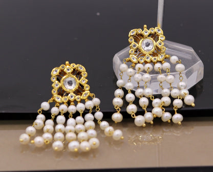 22K yellow gold handmade Kundan Jadau stud earrings with dangling pearls, exquisite bridal jewelry by TRIBAL ORNAMENTS.