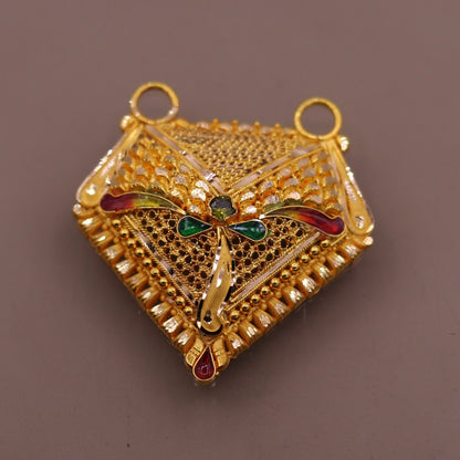 22KT yellow gold handmade filigree pendant by TRIBAL ORNAMENTS featuring intricate Indian wedding and party jewelry design.