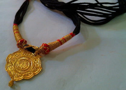22KT yellow gold handmade tribal pendant featuring Shree Nathji design, antique ethnic jewelry from Rajasthan by TRIBAL ORNAMENTS