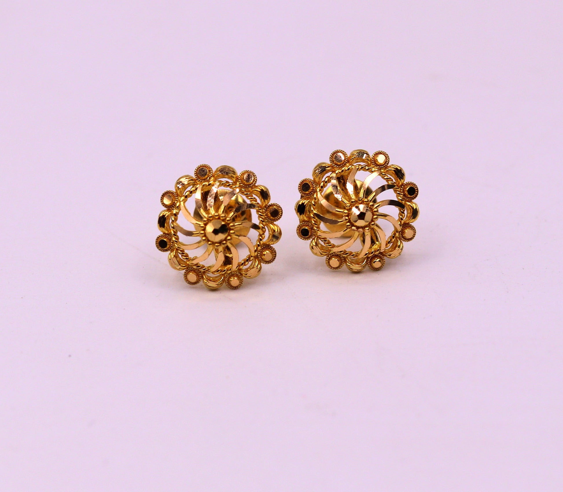 22Kt yellow gold handmade filigree stud earrings showcasing intricate Indian ethnic design and modern solid gold jewelry style.