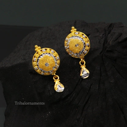 22KT yellow gold handmade designer stud earrings by TRIBAL ORNAMENTS, featuring a stylish, elegant design for daily wear or bridal gift.