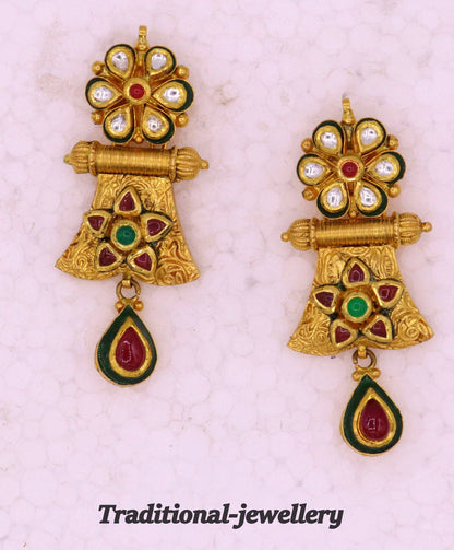 22KT yellow gold handmade vintage Kundan stone Jadau earrings from Tribal Ornaments, elegant women's jewelry for weddings and anniversaries.