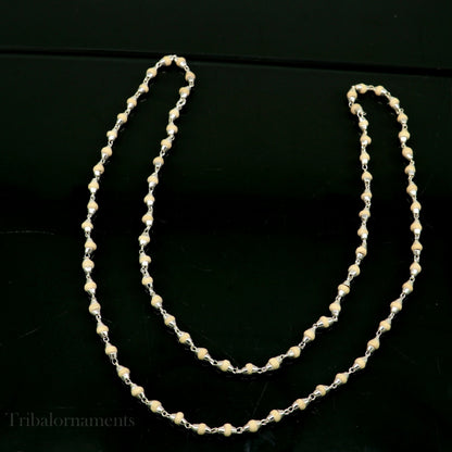 Unisex 24-inch sterling silver necklace with handmade wooden beads and Holy basil rosary beads, featuring a silver chain and custom design.