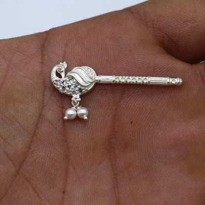 Handmade 3.5cm sterling silver Krishna flute with peacock design, featuring idol Gopala and laddu motifs, crafted by Tribal Ornaments.