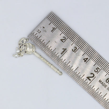 Handmade 3.5cm silver Krishna flute with peacock design, featuring Laddu Gopala idol, crafted in 925 sterling silver.