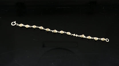 Handmade 925 sterling silver basil rosary beads necklace by TRIBAL ORNAMENTS for Lord Krishna statues, showcasing intricate craftsmanship.