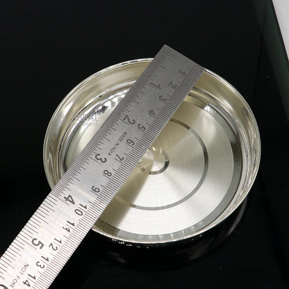 Handmade 4-inch 999 fine silver baby food tray and utensils by Tribal Ornaments, with intricate silver articles and puja utensils.