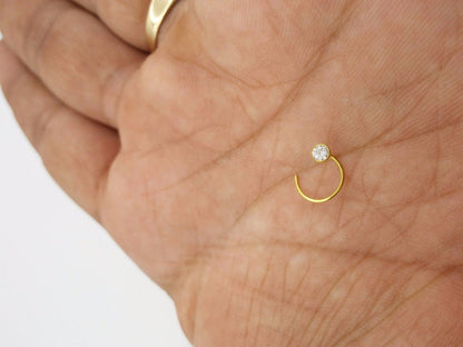 18k gold nose pin with white stone from Tribal Ornaments, simple design, 4 mm size, traditional Indian jewelry, elegant and minimal.