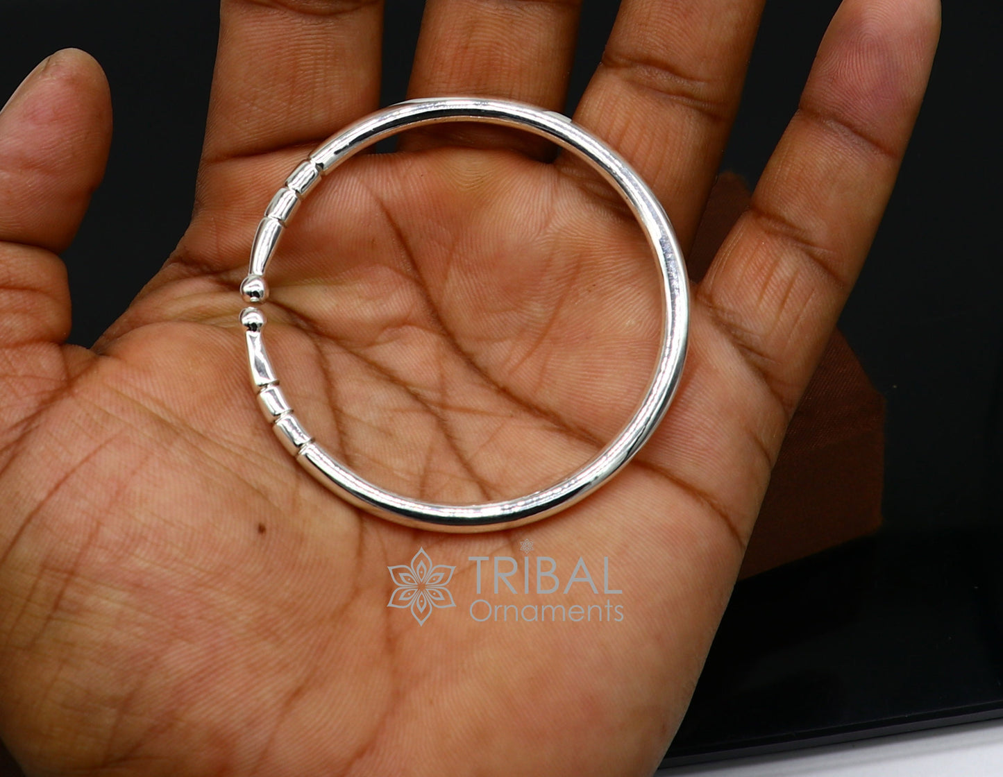 Sterling silver handmade bangle bracelet with a shiny plain design, adjustable unisex kada by TRIBAL ORNAMENTS.