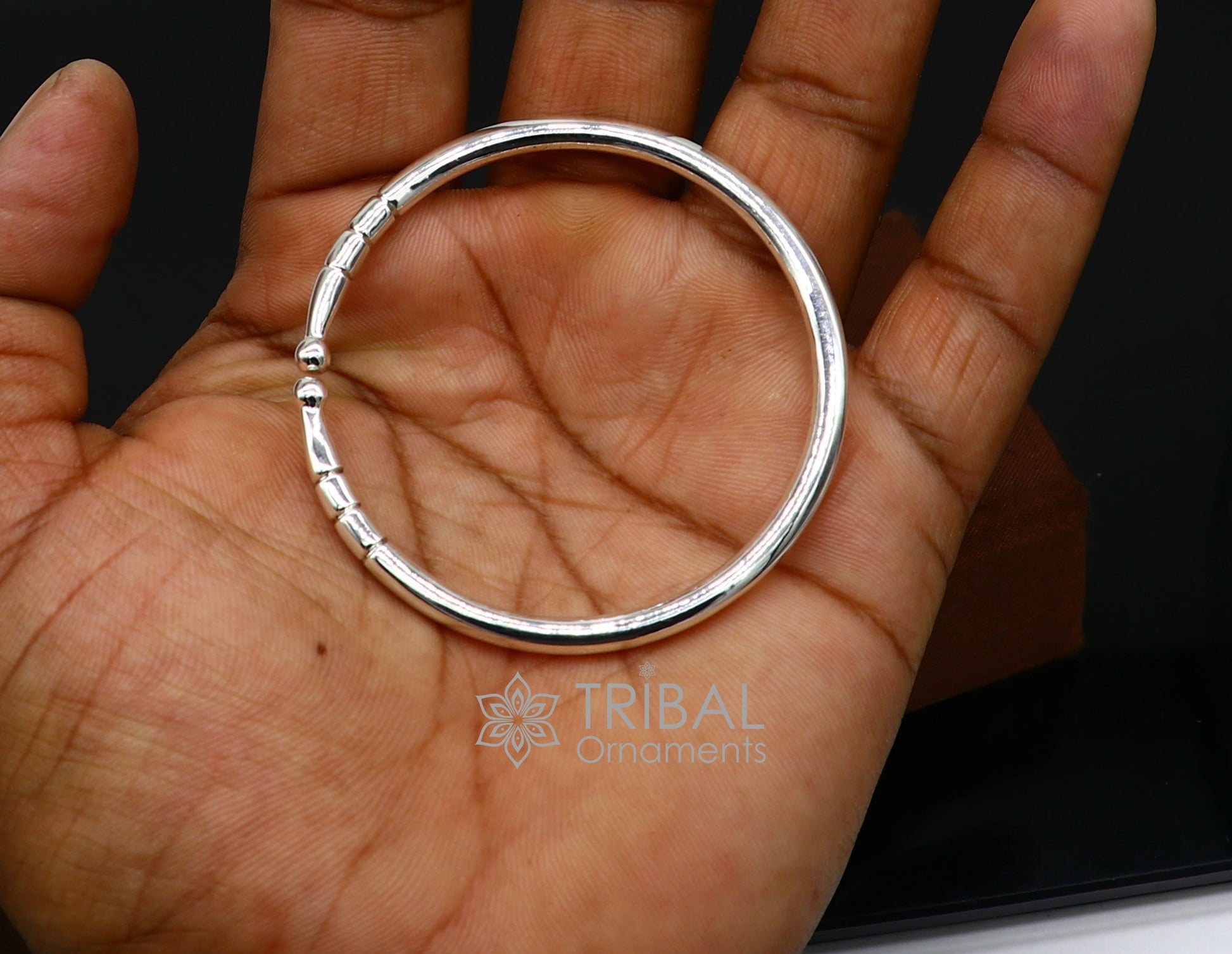 Sterling silver handmade bangle bracelet with a shiny plain design, adjustable unisex kada by TRIBAL ORNAMENTS.